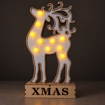 Rozsvícený dřevěný sob XMAS za šera